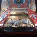 2p_coins_on_pusher_at_Butlins,_Minehead_2009